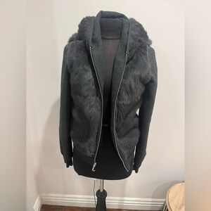 Like new Very unique reversible  black jacket with faux fur  trim.